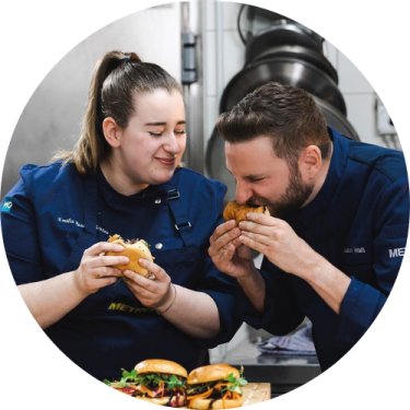 Emilia Eppensteiner and Aaron Waltl eating Burger