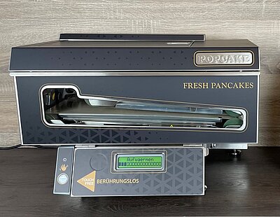 Pancake Maschine für frische heiße Pancakes per Handzeichen. Offizieller Partner von Popcake.