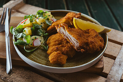 Fried chicken breaded, cooked